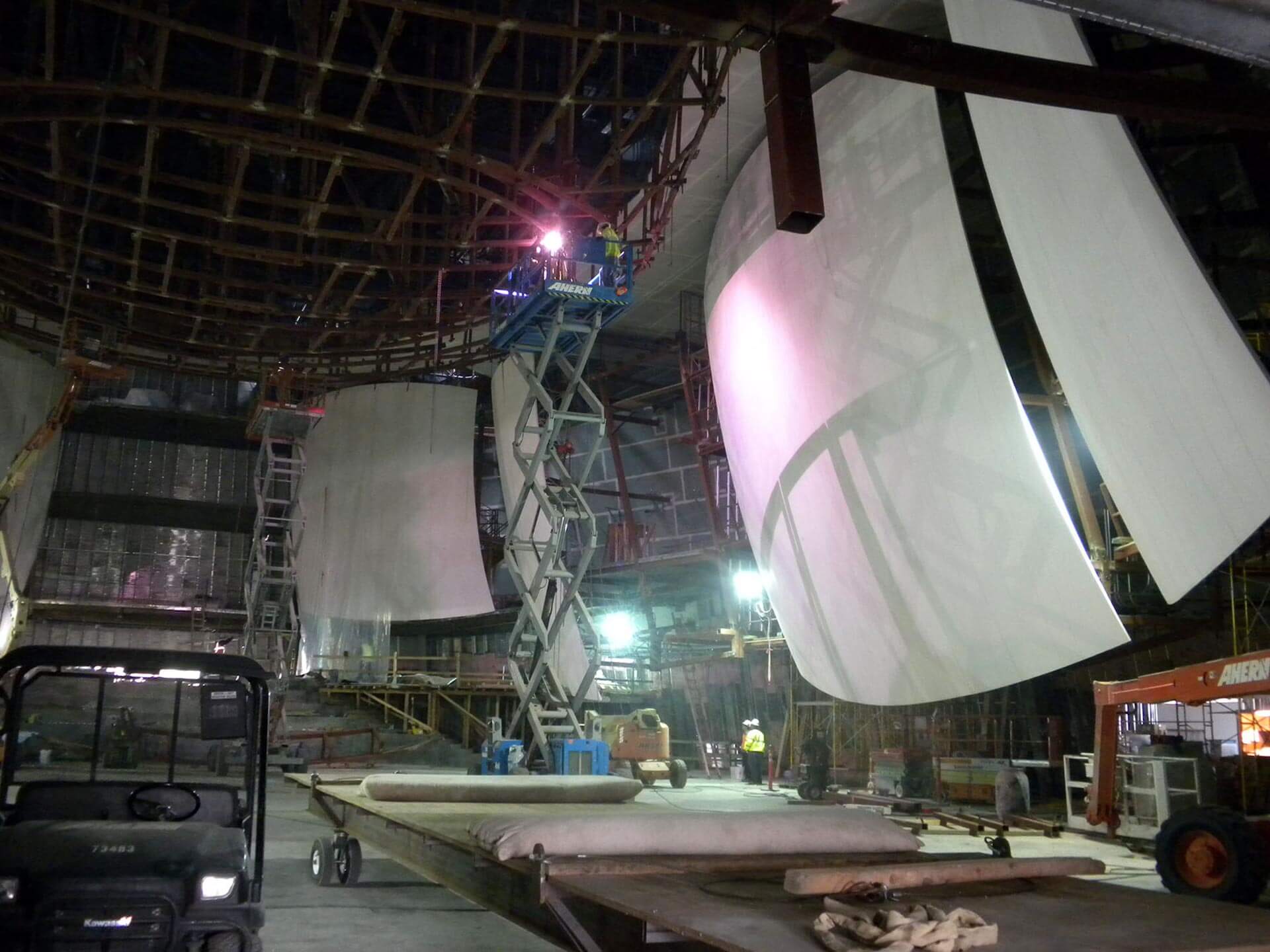 Multiple large acoustic panels hanging from stage